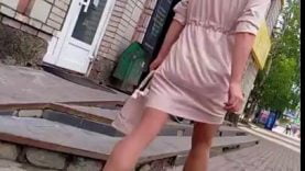 Public voyeur video of a girl with well toned legs wearing short dress