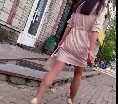 Public voyeur video of a girl with well toned legs wearing short dress